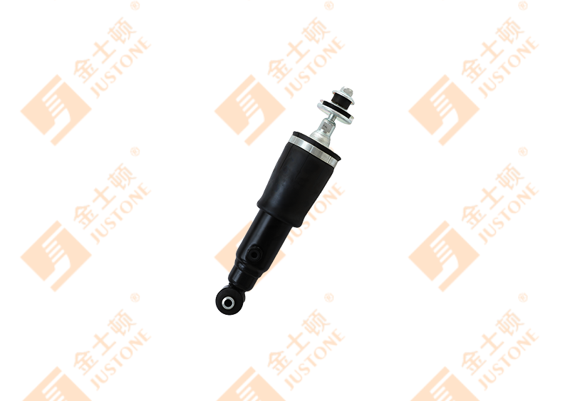 How do drive-down cabin shock absorbers work to minimize vibrations and shocks in the cabin of a vehicle or machinery?